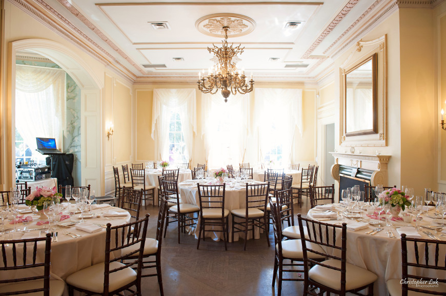 Christopher Luk - Toronto Wedding Portrait Event Photographer - Graydon Hall Manor - Gold Champagne Pink Main Hall Room Wide Overview Chiavari Chairs Centrepieces Flatware Glassware Linens Tablecloths Flower Petals Floral Arrangements Mirror Chandelier Hardwood Floor Fireplace Mantel Crown Moulding