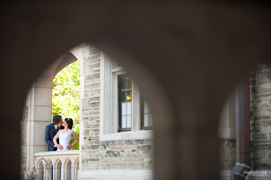 Christopher Luk 2014 - Mikiko and George's Casa Loma Wedding - Toronto Event Lifestyle Photographer - Bride and Groom Creative Relaxed Portrait Session Photojournalistic Natural Candid Exterior Castle Arch Hug Kiss