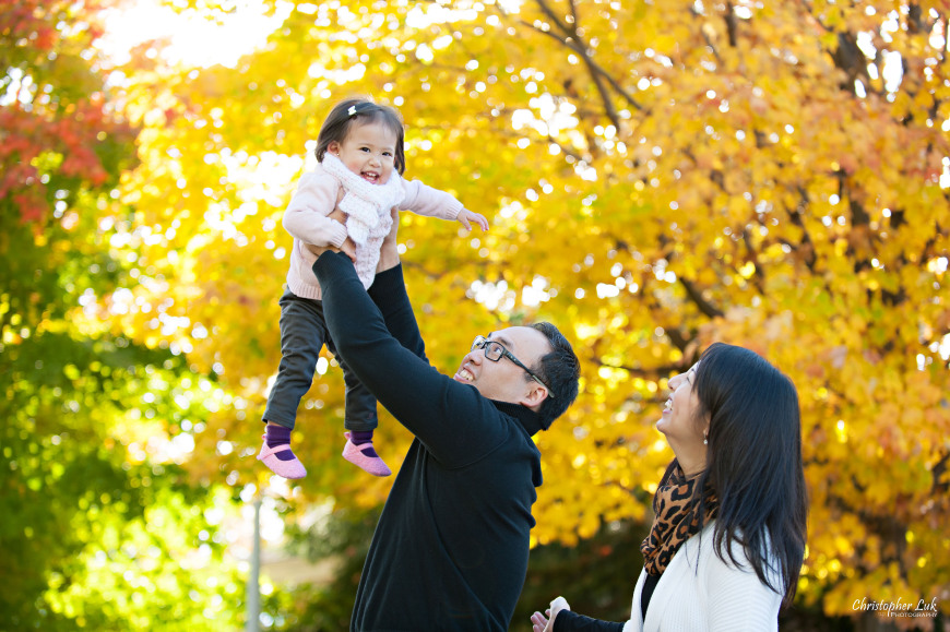 Christopher Luk 2014 - The C Family Baby Toddler Girl Lifestyle Session - Toronto Wedding Event Photographer - Mother Father Mom Dad Daughter Toddler Baby Girl Walking Smiling Orange Colour Autumn Fall Leaves Photojournalistic Candid Natural Relaxed Lift Jump Bounce Fly Laugh Smile
