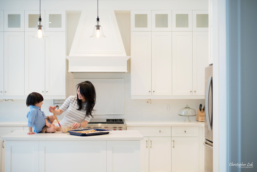 Christopher Luk 2015 - Toronto Family Toddler Winter Spring Indoor Home Session - Mom Toddler Son Boy Blue Grey White Striped Shirt Fashion Children Lifestyle Kitchen Centre Island Fun Candid Photojournalistic Finger Cute Baking Stirring Mixing Together