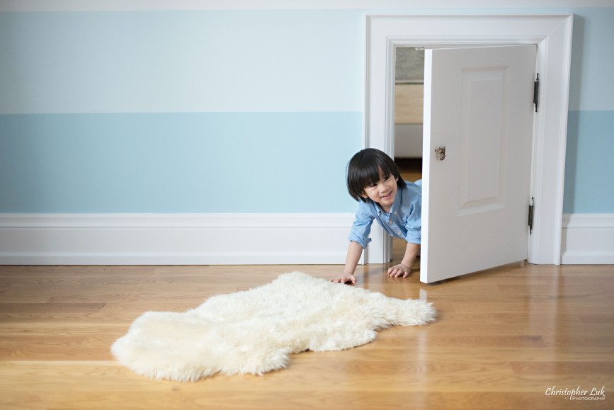 Christopher Luk 2015 - Toronto Family Toddler Winter Spring Indoor Home Session - Toddler Son Boy Blue Shirt Fashion Children Lifestyle Bedroom Fun Candid Photojournalistic Crawling Crawlspace Crawl Space Secret Door Passage Passageway Entrance Laugh Smile