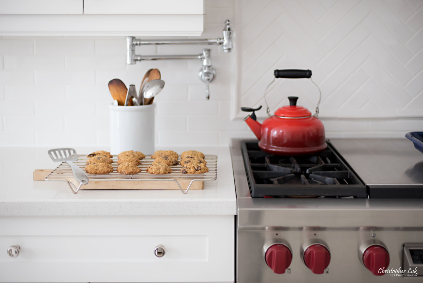 Christopher Luk 2015 - Toronto Family Toddler Winter Spring Indoor Home Session - Lifestyle Kitchen Centre Island Counter White Cabinets Caesarstone Quartz Countertop Le Creuset Red Water Kettle Wolf Gas Stove Oven Range Pot Filler