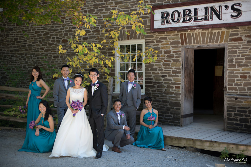 Fall Autumn Wedding Creative Relaxed Portrait Session Photojournalistic Candid Natural Posed Black Creek Pioneer Village Bride Bridesmaids Floral Bouquets Groomsmen Old Mill Entrance Bridal Party Group Smile