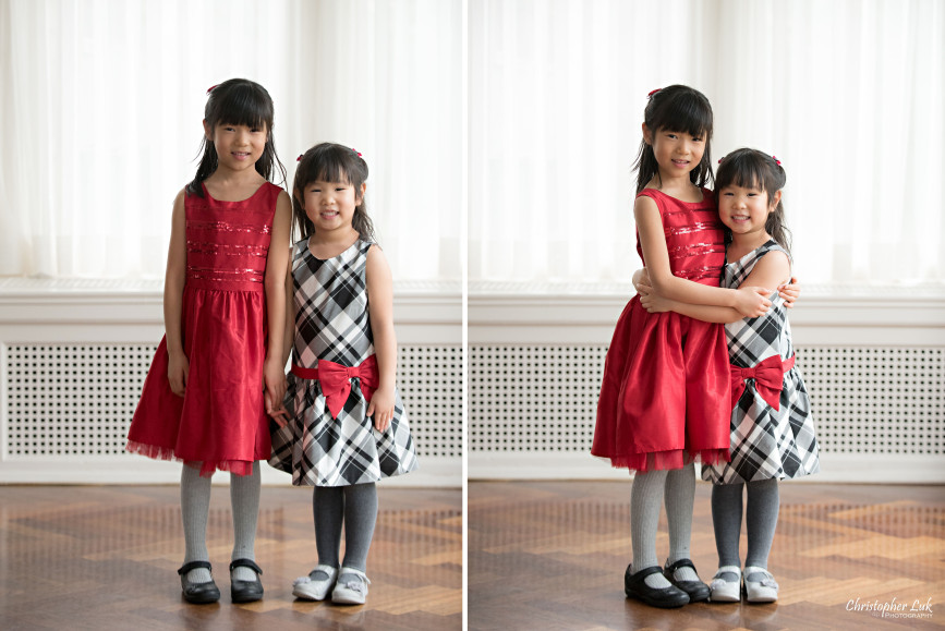 Toronto Markham Family Children Photographer - Daughters Sisters Girls Red White Grey Black Bow Dress Smile Standing Hug