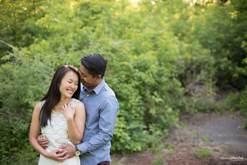 Christopher Luk (Toronto Wedding, Portrait & Event Photographer): Victoria and Jason’s Engagement Session at Main Street Unionville Markham TooGood Pond Park - Natural Candid Photojournalistic Bride Groom Funny Laugh Greenery Foliage Shrubs