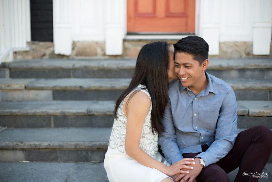 Christopher Luk (Toronto Wedding, Portrait & Event Photographer): Victoria and Jason’s Engagement Session at Main Street Unionville Markham TooGood Pond Park - Natural Candid Photojournalistic Bride Groom Funny Laugh Stairs Staircase Sitting Red Door Kiss Talking Whispering In Ear