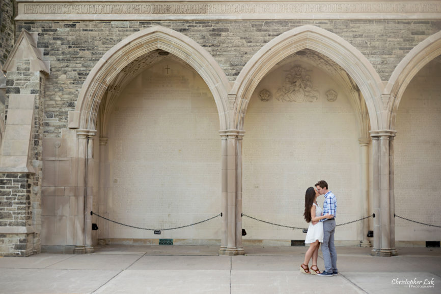 Christopher Luk (Toronto Wedding, Lifestyle & Event Photographer): Cindy and Matthew’s University of Toronto Downtown Engagement Session - Bride Groom Natural Candid Photojournalistic University College Memorial Archway Hug