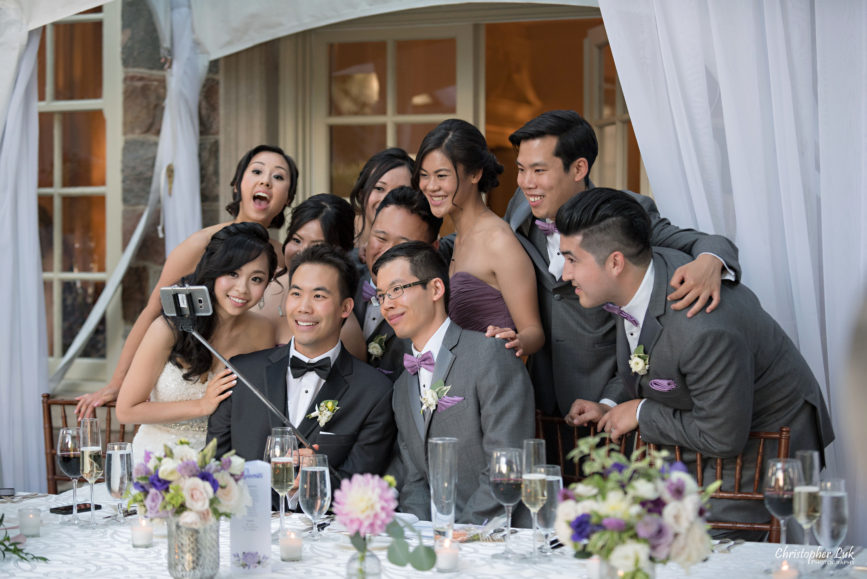 Christopher Luk (Toronto Wedding Photographer): Christine and Jonathan's Wedding - Graydon Hall Manor Toronto Foodie Summer Outdoor Garden Ceremony Patio Terrace Tent Dinner Reception Evening Mansion Estate Exterior Stone Dinner Candid Natural Photojournalistic Bridal Party Kissing Game Group Selfie Stick