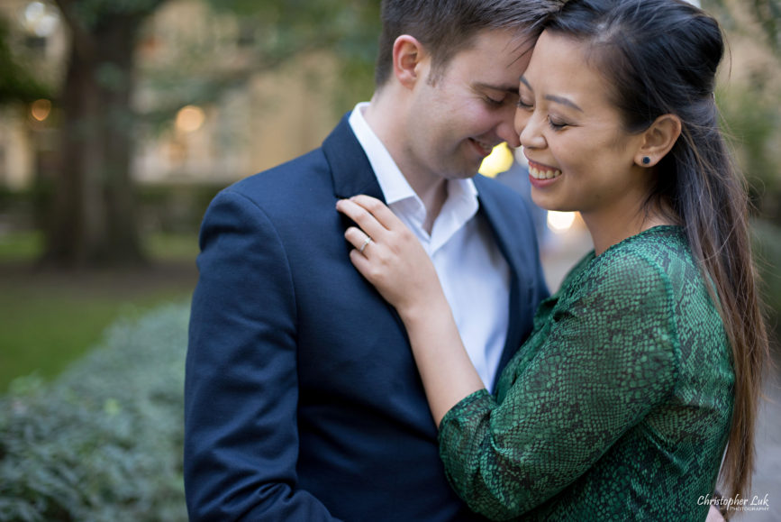 Christopher Luk (Toronto Wedding Photographer): University of Toronto College Doctor of Medicine Engagement Session Groom Natural Candid Photojournalistic Walkway Shrubs Old Trees Intimate Close Hold Tight Smile