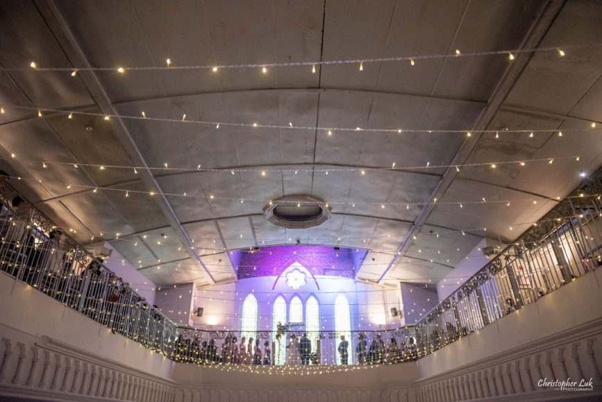 Christopher Luk (Toronto Wedding Photographer): Berkeley Church Vintage Rustic Ceremony Candlelight Dinner Reception Pinterest Worthy Details Candid Natural Photojournalistic Bride Groom Hanging Christmas Lights Bulbs Mezzanine Balcony Wide