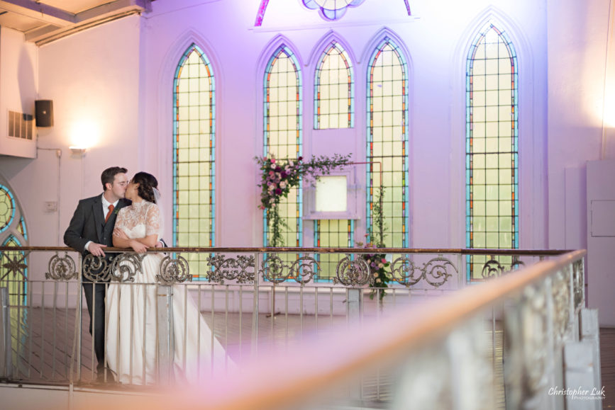 Christopher Luk (Toronto Wedding Photographer): Berkeley Church Vintage Rustic Ceremony Candlelight Dinner Reception Pinterest Worthy Details Candid Natural Photojournalistic Bride Groom Balcony Mezzanine Staircase Railing Banister Kiss