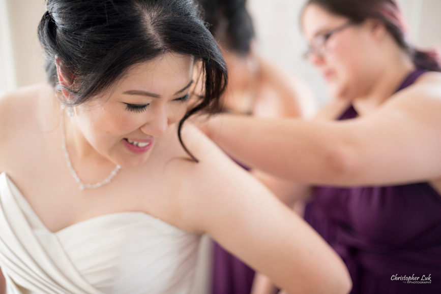 Toronto Wedding Photographer Heintzman House Winter Wedding Markham York Region Historic Estate Event Venue Photojournalistic Documentary Candid Natural Creative Bridal Room Bride Bridesmaids Getting Ready Corset Dress Gown Plum Purple Henkaa Close Up Smile Detail