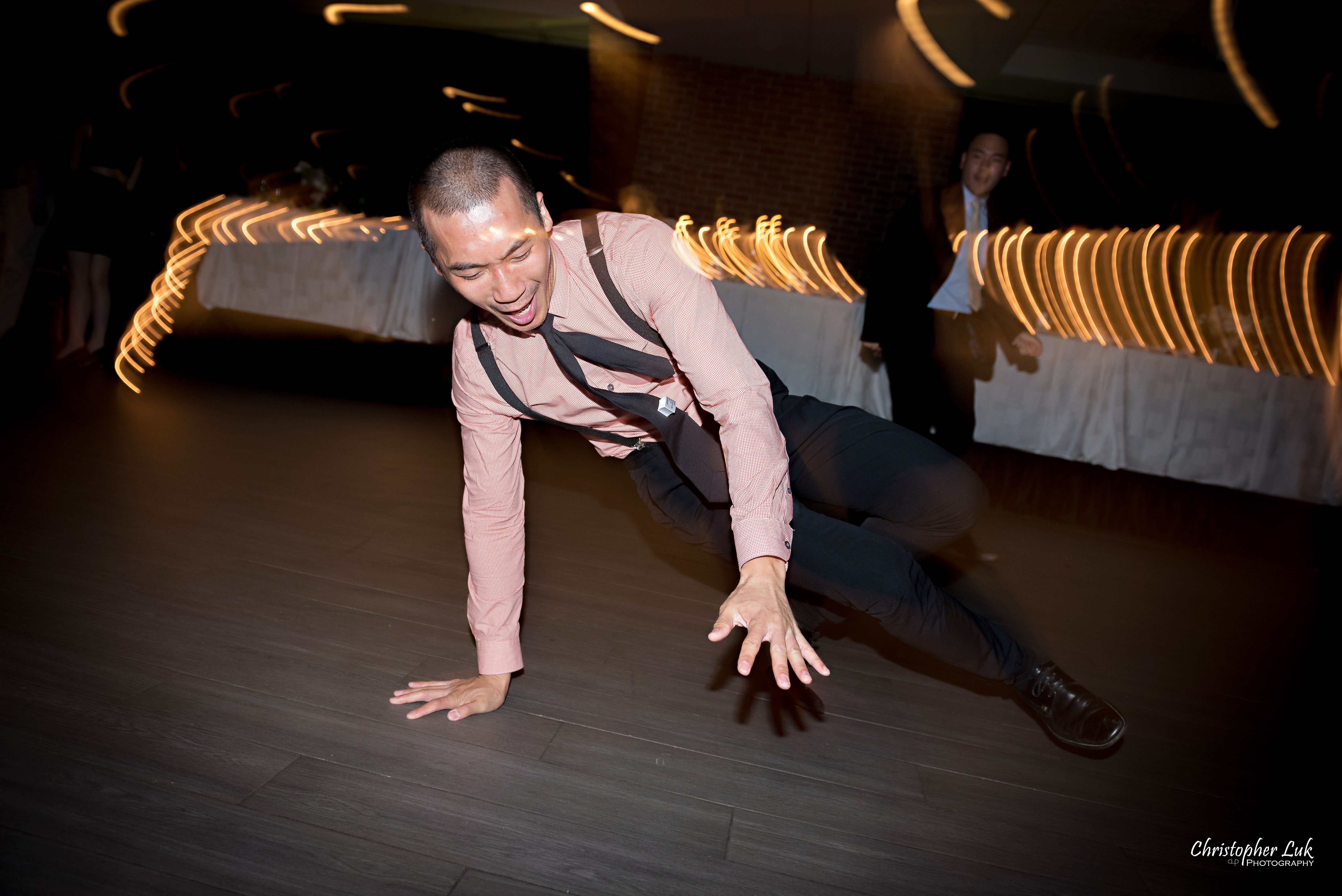 Christopher Luk - Toronto Wedding Photographer - The Manor Event Venue By Peter and Paul's - Cocktail Hour & Dinner Reception Candid Natural Photojournalistic Guests Friends Family Dancing Dance Moves Floor Fun Floor Spin Spinning