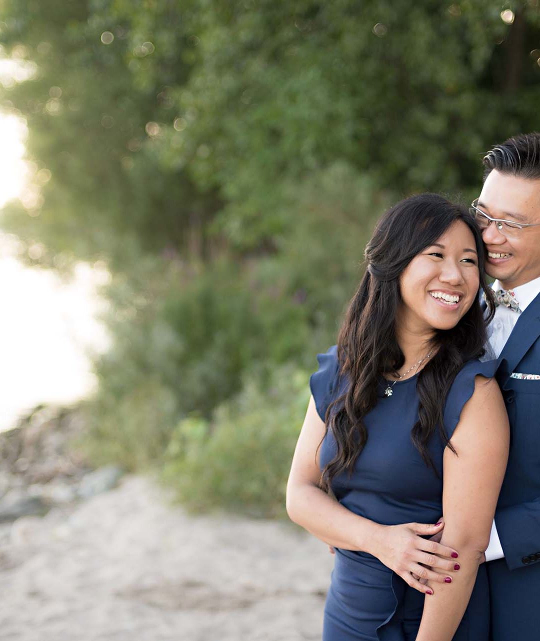 Christopher Luk Toronto Wedding Photographer - Engagement Photography - Sunnyside Pavilion Park Beach Boardwalk Toronto - Bride and Groom Natural Candid Photojournalistic Hug Smile Trees Close Love