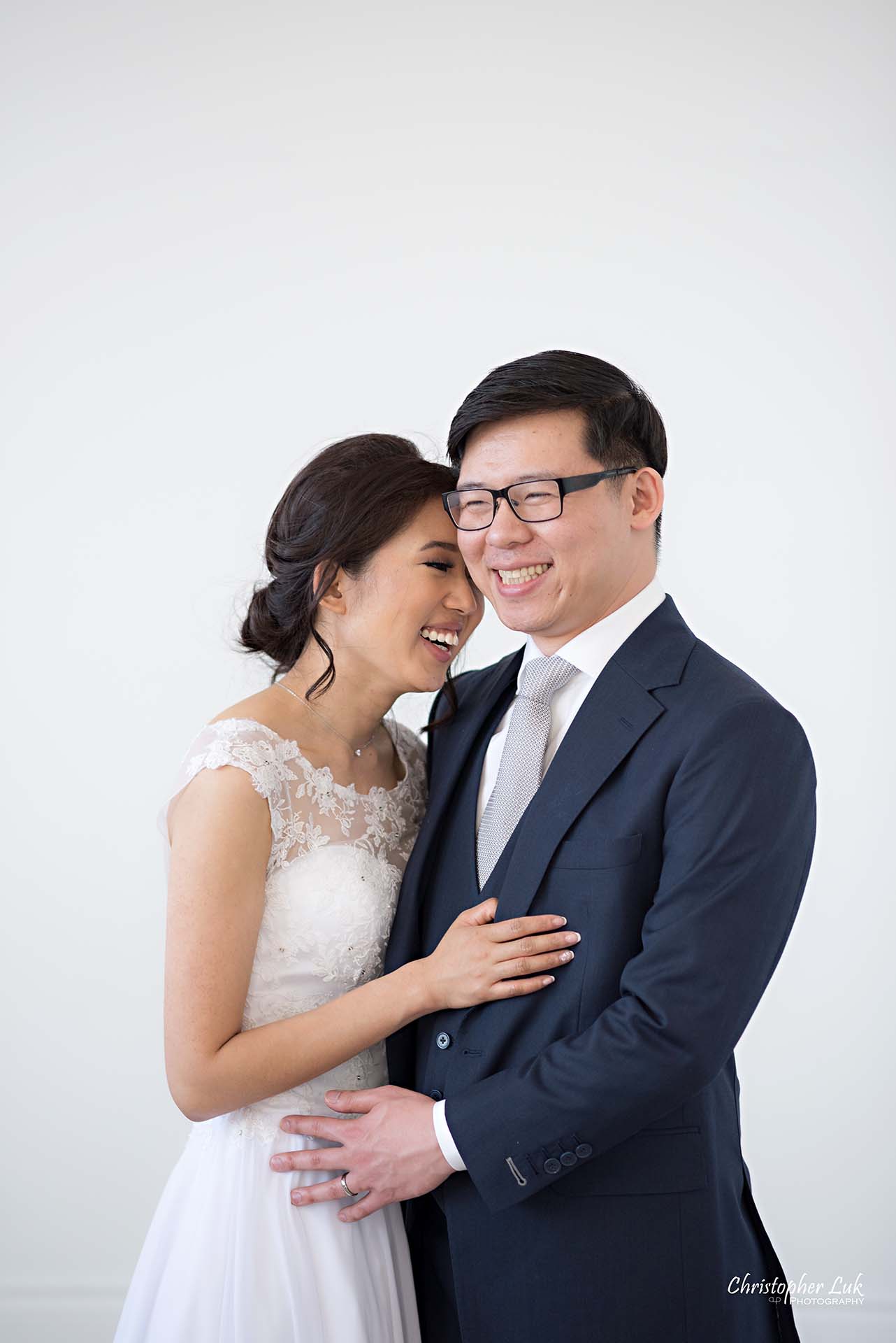 Christopher Luk Toronto Wedding Photographer - Mint Room Studios Bride Groom Natural Candid Photojournalistic Conservatory Ballroom Hug Laugh Holding Each Other Close