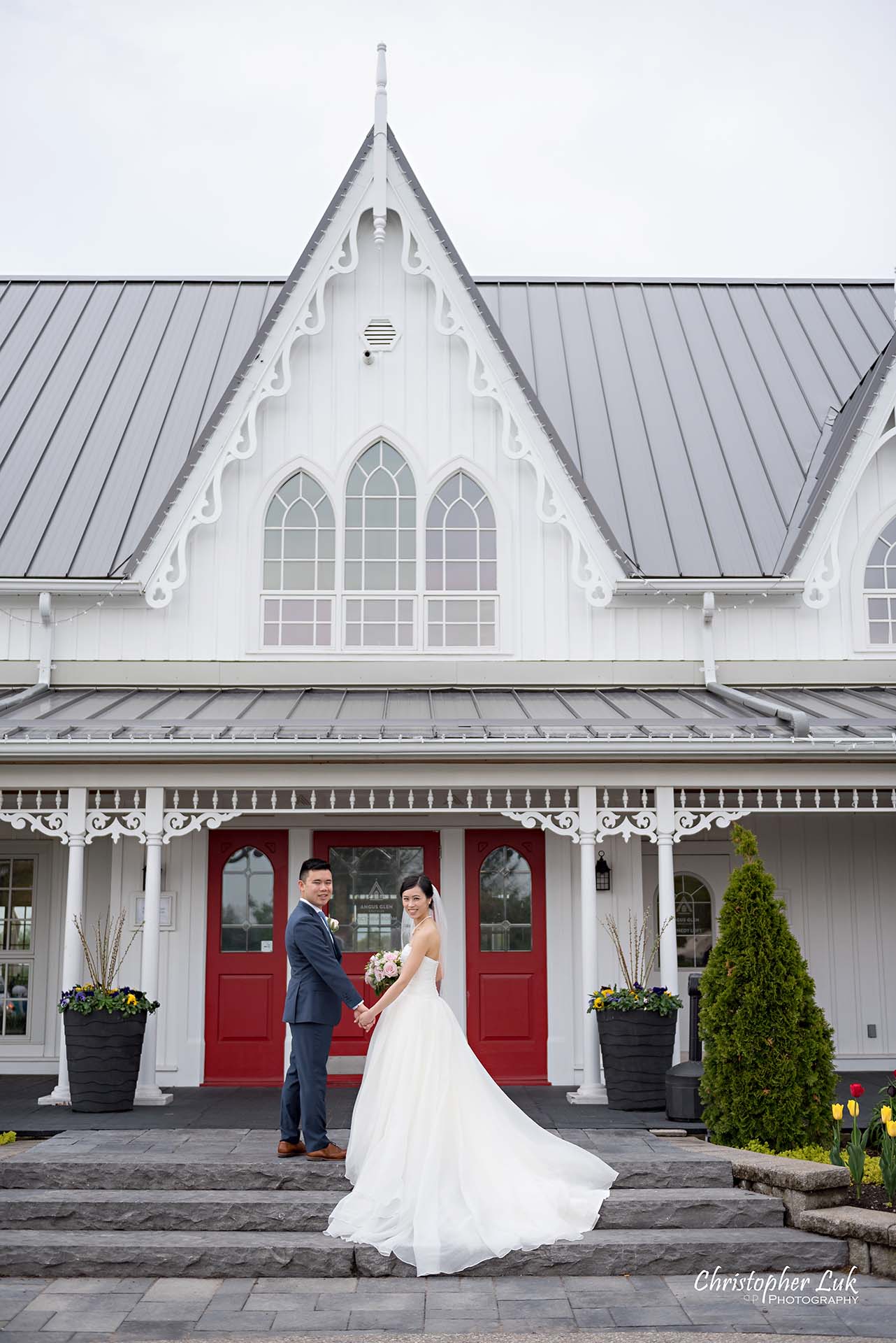 Christopher Luk Toronto Wedding Photographer Angus Glen Golf Club Markham Victoria Room Kennedy Loft Main Historic Estate Building Entrance Together Natural Candid Photojournalistic Bride Groom Bridal Gown Dress Train Staircase Looking at Camera Portrait