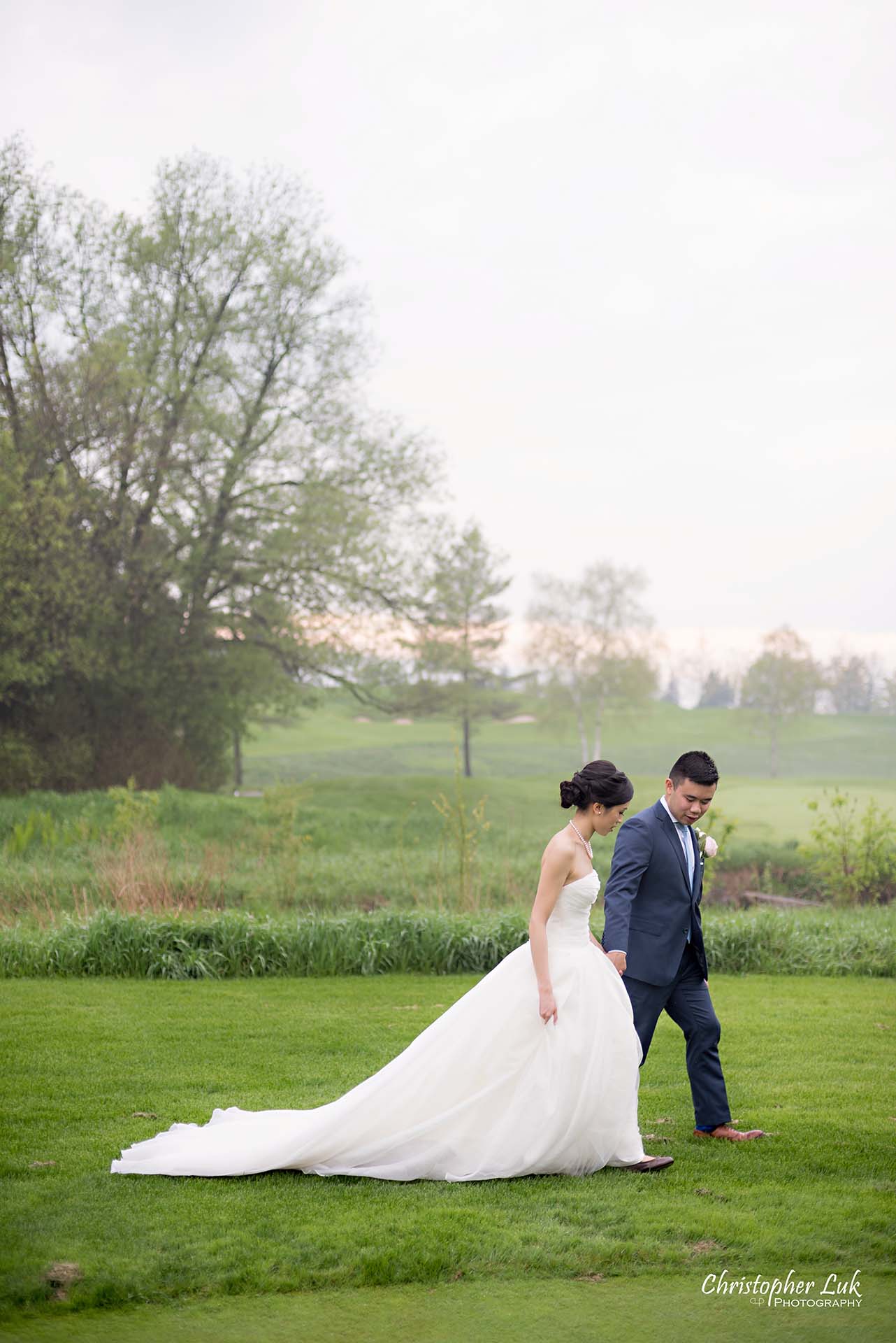 Christopher Luk Toronto Wedding Photographer Angus Glen Golf Club Markham Great Hall Dinner Reception Event Venue Green Field Sunset Bride Groom Natural Candid Photojournalistic Walking Together 