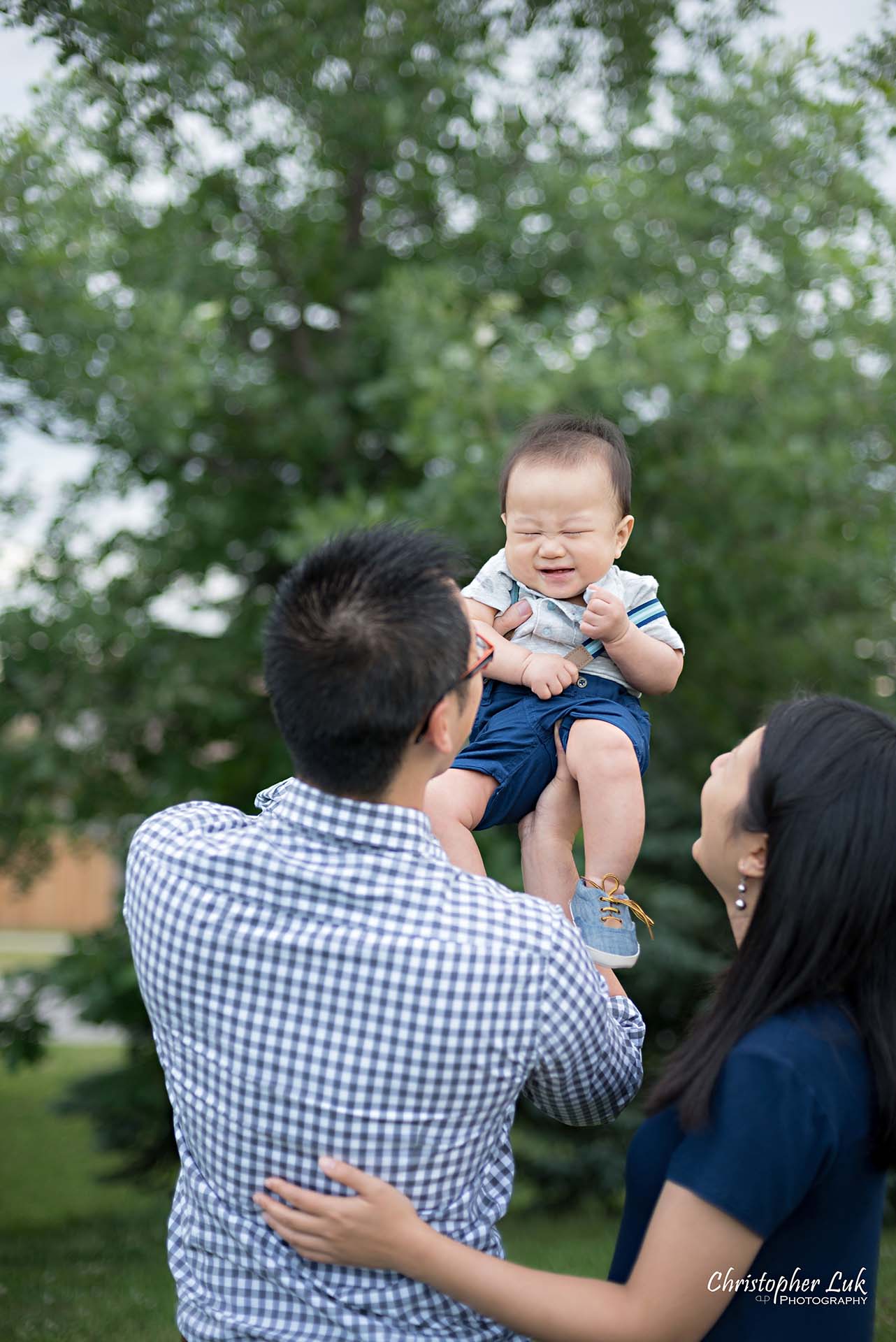 Christopher Luk Family Baby Wedding Photographer Richmond Hill Markham Toronto - Candid Natural Photojournalistic Father Mother Dad Mom Motherhood Fatherhood Baby Smile Cute Adorable Lifted Up Simba Lion King Squishy Face Smile