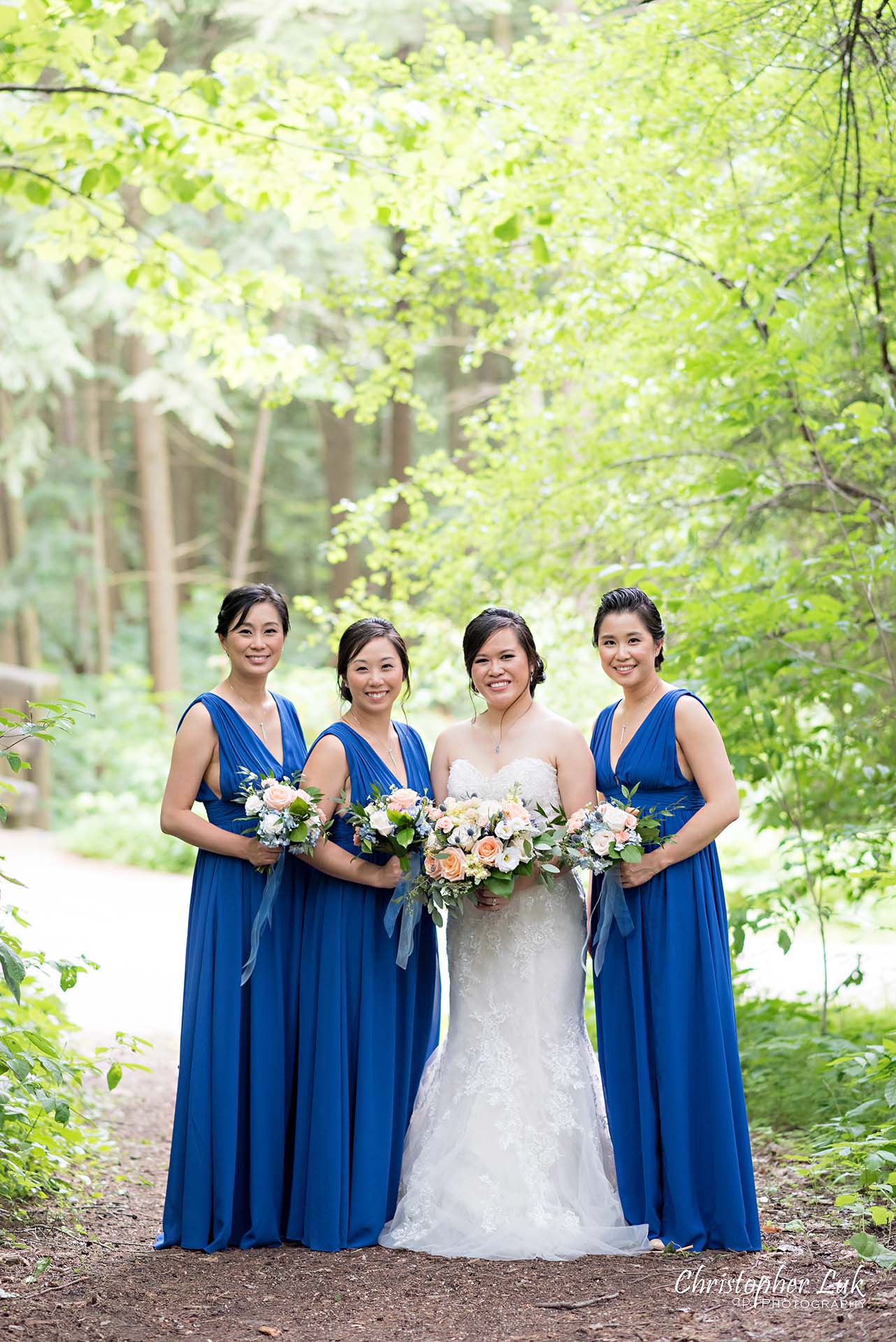 Christopher Luk Toronto Christian Community Church Kleinburg McMichael Art Gallery Presidente Banquet Hall Vaughan Wedding Photographer Bride Bridal Party Bridesmaids Matron Maid of Honour Natural Candid Photojournalistic Forest Woods Wooded Area Tall Trees Blue Dresses Smile 