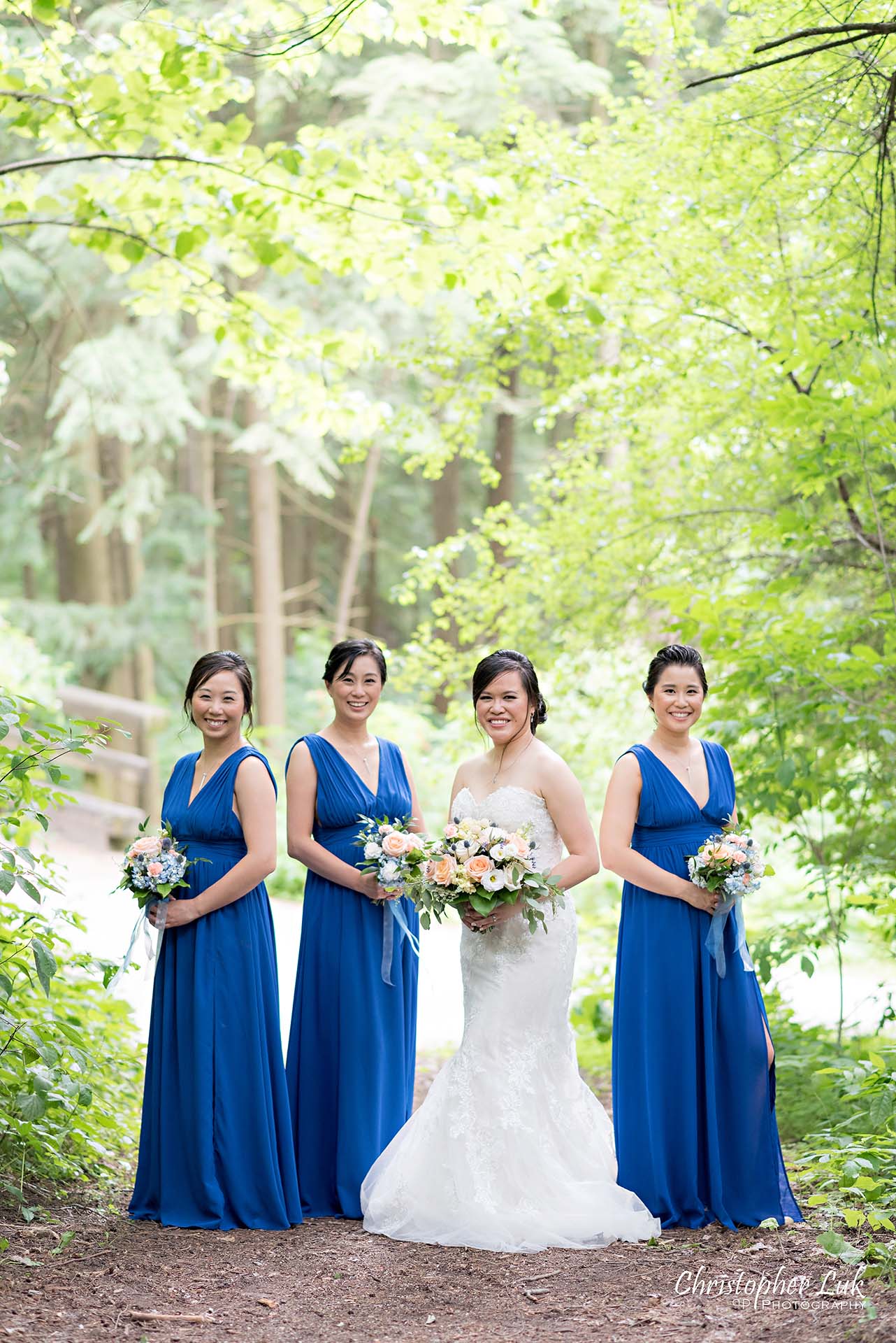 Christopher Luk Toronto Christian Community Church Kleinburg McMichael Art Gallery Presidente Banquet Hall Vaughan Wedding Photographer Bride Bridal Party Bridesmaids Matron Maid of Honour Natural Candid Photojournalistic Forest Woods Wooded Area Tall Trees Blue Dresses Smile Creative Pose