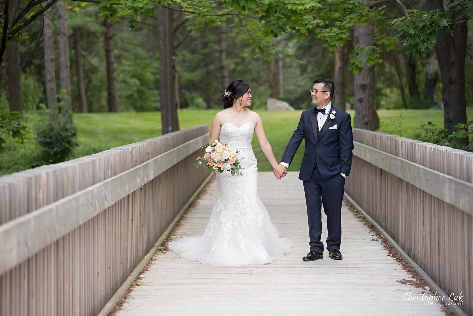 Christopher Luk Toronto Christian Community Church Kleinburg McMichael Art Gallery Vaughan Wedding Photographer Bride Groom Candid Natural Photojournalistic Wooden Bridge Boardwalk Intimate Leading Lines Looking at Each Other Walking