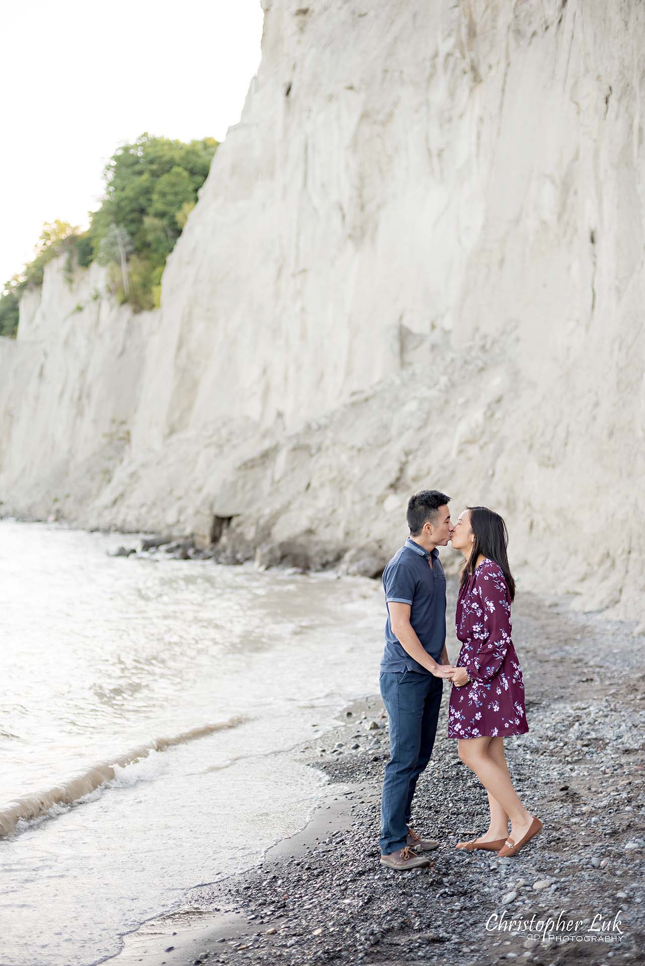 Christopher Luk Toronto Photographer Scarborough Bluffs Beach Park Sunset Surprise Wedding Marriage Engagement Proposal Candid Natural Photojournalistic Bride Groom Waterfront Water Lake Ontario Background Beachfront Sand Walking Together Holding Hands Edge of Water Smile Stone Portrait Kiss