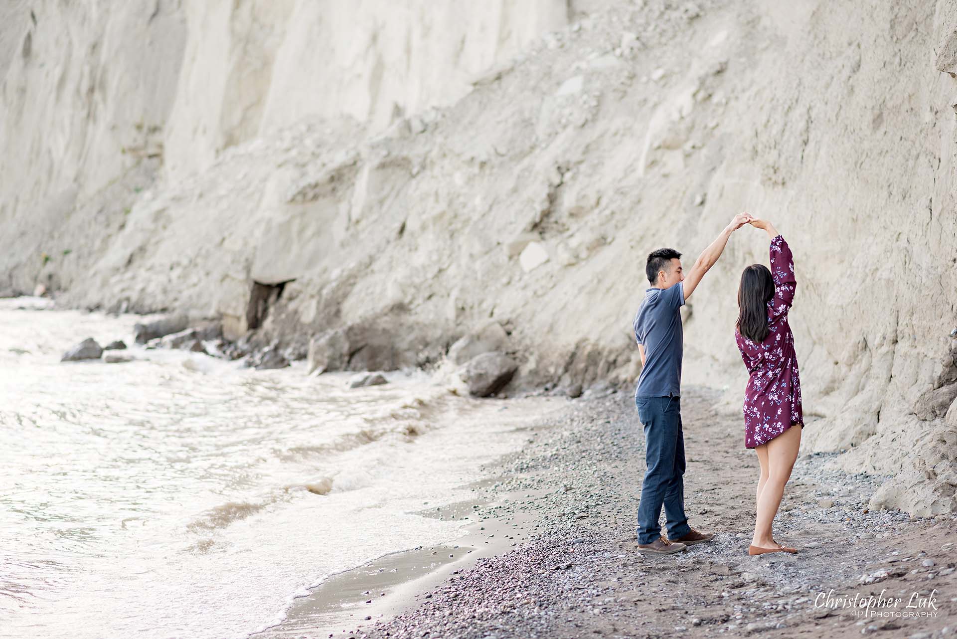 Christopher Luk Toronto Photographer Scarborough Bluffs Beach Park Sunset Surprise Wedding Marriage Engagement Proposal Candid Natural Photojournalistic Bride Groom Waterfront Water Lake Ontario Background Beachfront Sand Walking Together Holding Hands Edge of Water Smile Stone Dancing Spin Twirl Dance