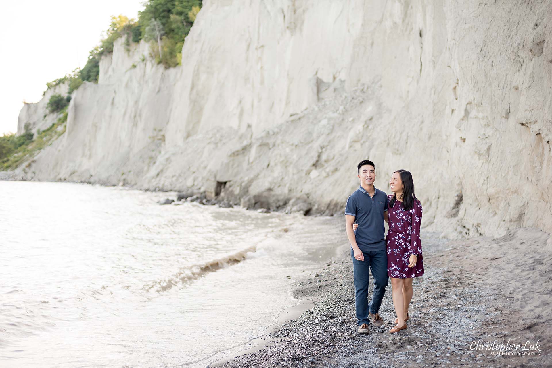 Christopher Luk Toronto Photographer Scarborough Bluffs Beach Park Sunset Surprise Wedding Marriage Engagement Proposal Candid Natural Photojournalistic Bride Groom Waterfront Water Lake Ontario Background Beachfront Sand Walking Together Holding Hands Edge of Water Smile Landscape