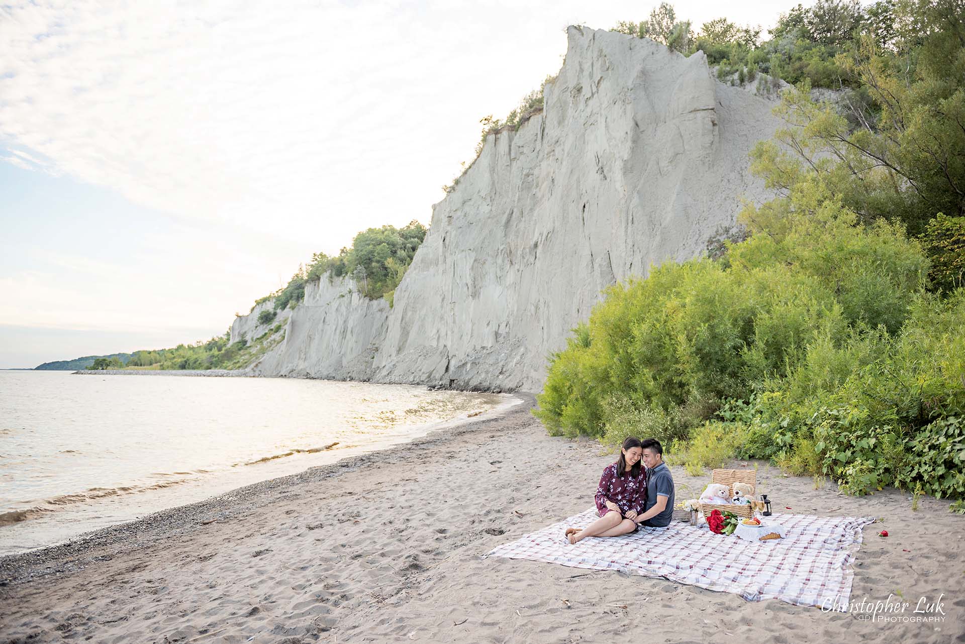 Christopher Luk Toronto Photographer Scarborough Bluffs Beach Park Sunset Surprise Wedding Marriage Engagement Proposal Candid Natural Photojournalistic Bride Groom Picnic Blanket Basket Teddy Bears Sitting Together Laughing Smiling Wide Landscape