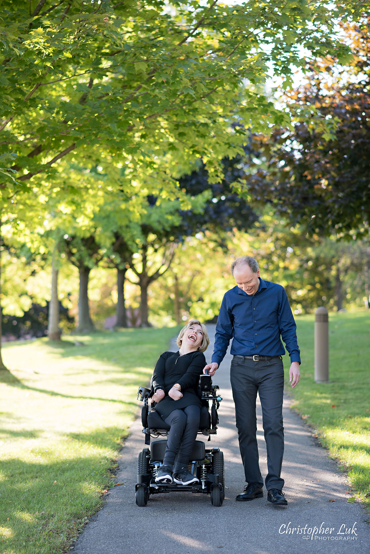 Christopher Luk Toronto Wedding Photographer Whitby Durham Engagement Session Bride Groom Candid Natural Photojournalistic Wheelchair Path Pathway Walking Together Smile Laugh