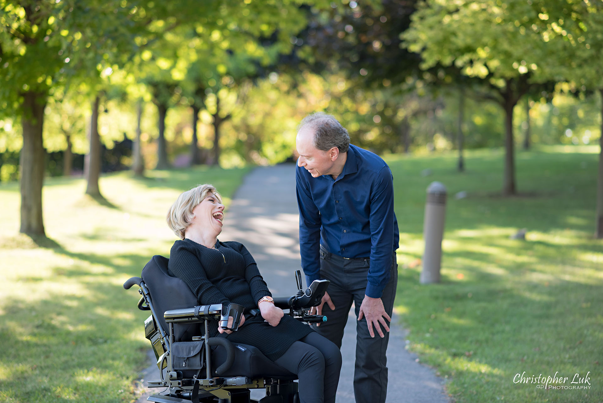 Christopher Luk Toronto Wedding Photographer Whitby Durham Engagement Session Bride Groom Candid Natural Photojournalistic Wheelchair Path Pathway Talking with Each Other Together Laugh