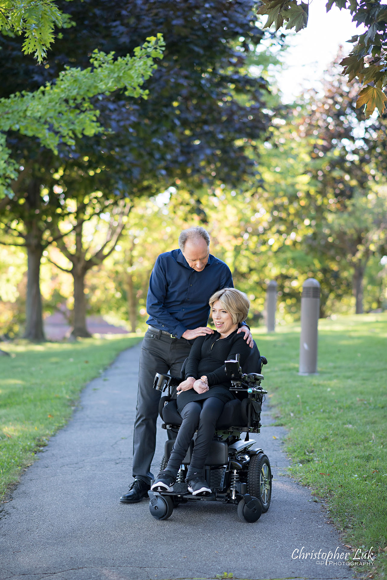 Christopher Luk Toronto Wedding Photographer Whitby Durham Engagement Session Bride Groom Candid Natural Photojournalistic Wheelchair Path Pathway Hug Shoulder