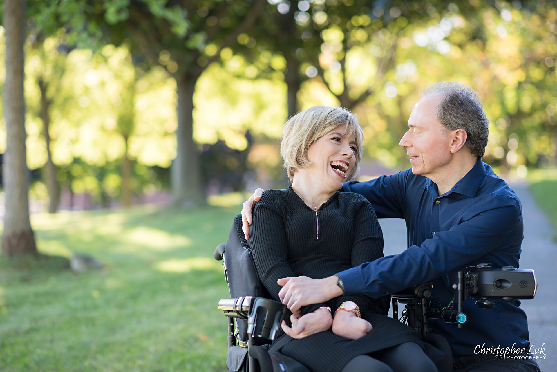 Christopher Luk Toronto Wedding Photographer Whitby Durham Engagement Session Bride Groom Candid Natural Photojournalistic Wheelchair Path Pathway Talking Together Wrap Arms Hug