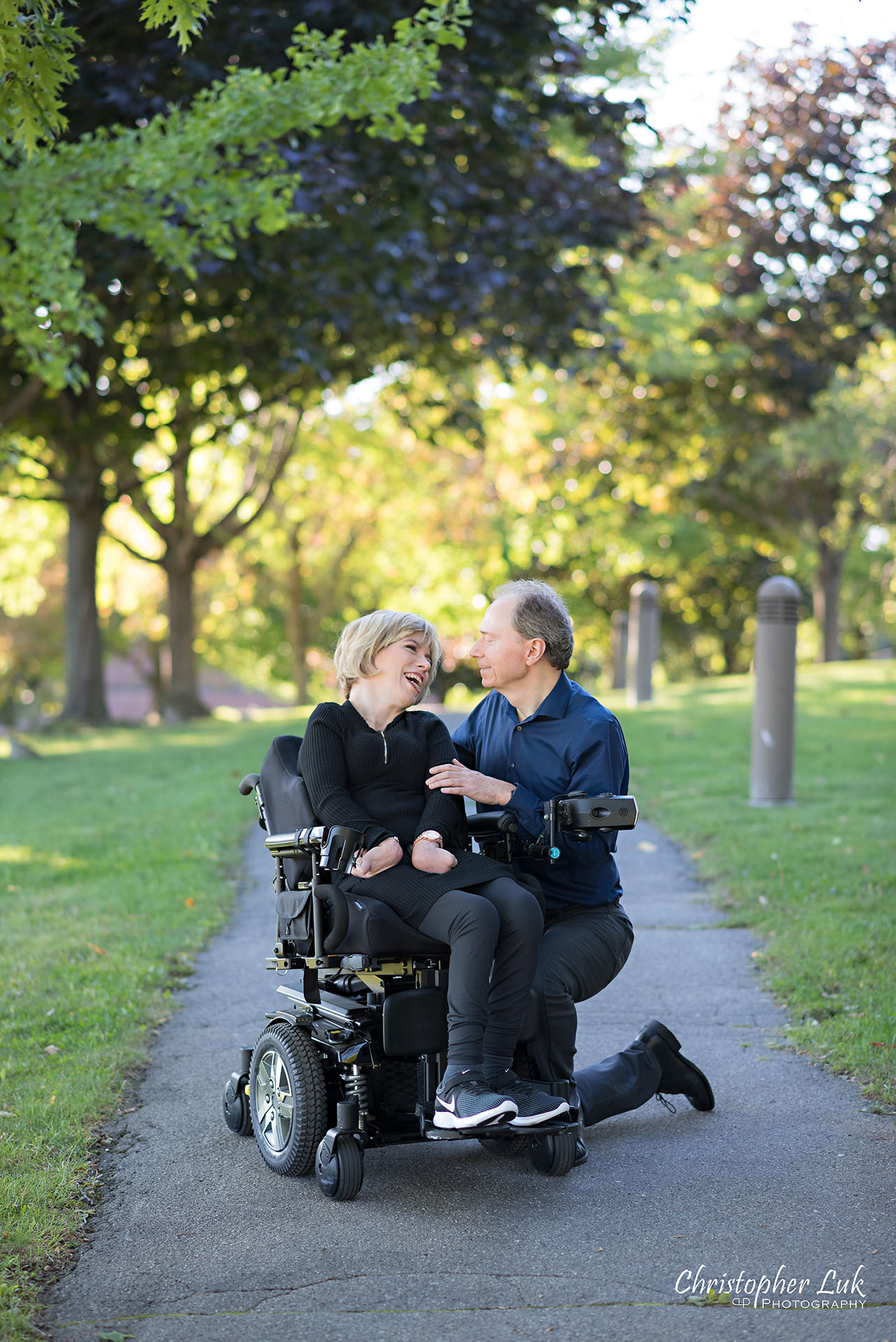 Christopher Luk Toronto Wedding Photographer Whitby Durham Engagement Session Bride Groom Candid Natural Photojournalistic Wheelchair Path Pathway Kneel Talking Together