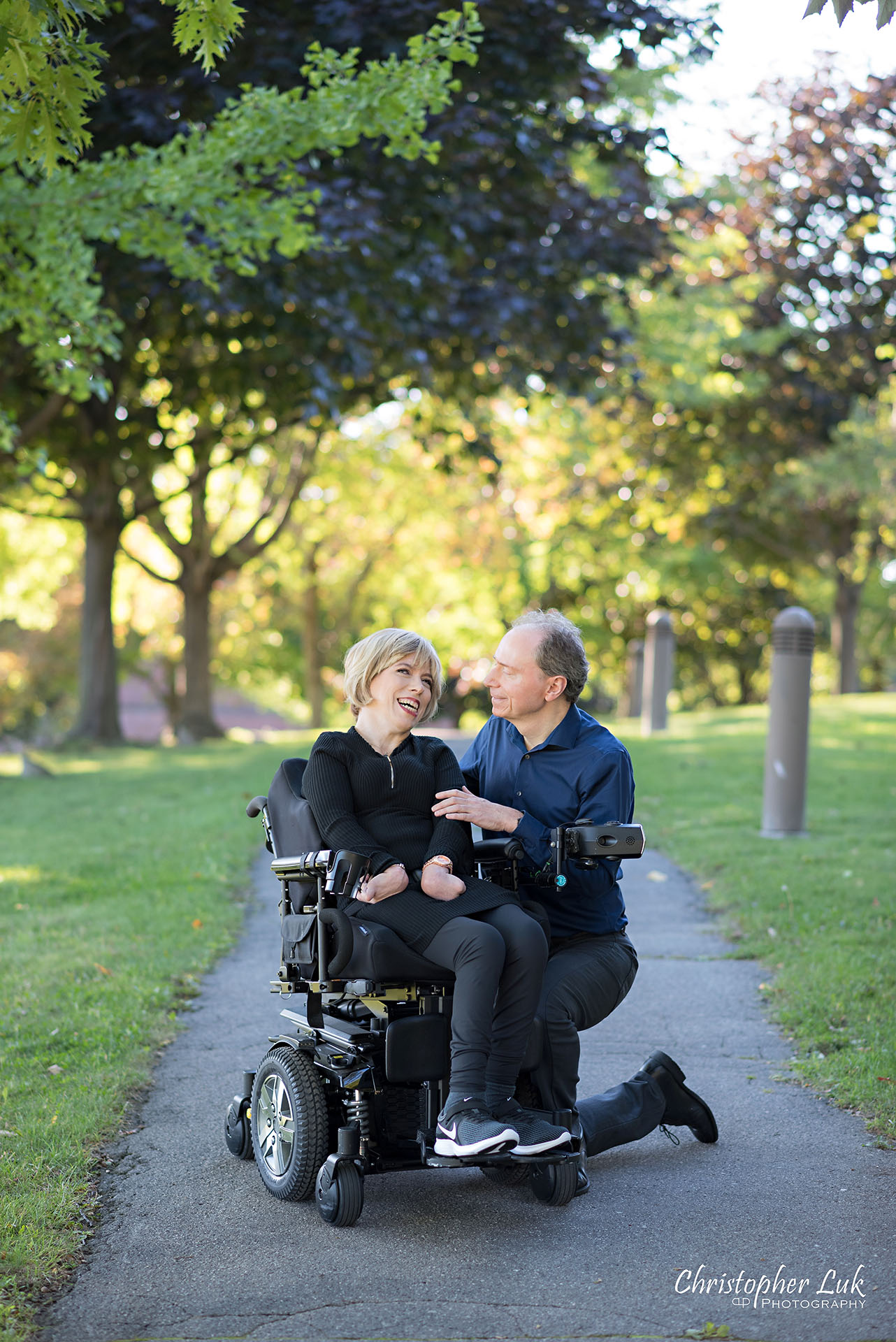 Christopher Luk Toronto Wedding Photographer Whitby Durham Engagement Session Bride Groom Candid Natural Photojournalistic Wheelchair Path Pathway Kneel Smile