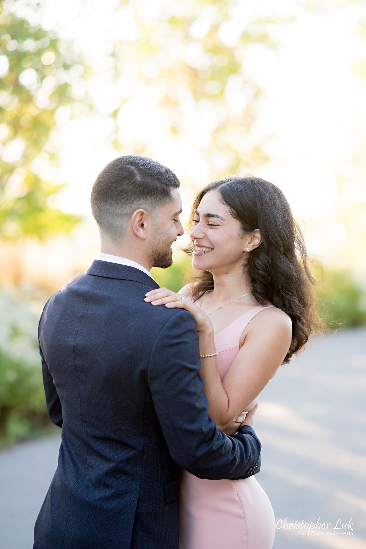 Christopher Luk Trillium Park Ontario Place Waterfront Engagement Session Toronto Wedding Photographer Bride Groom Natural Candid Photojournalistic Hug Hold Each Other Close Intimate Laugh Smile