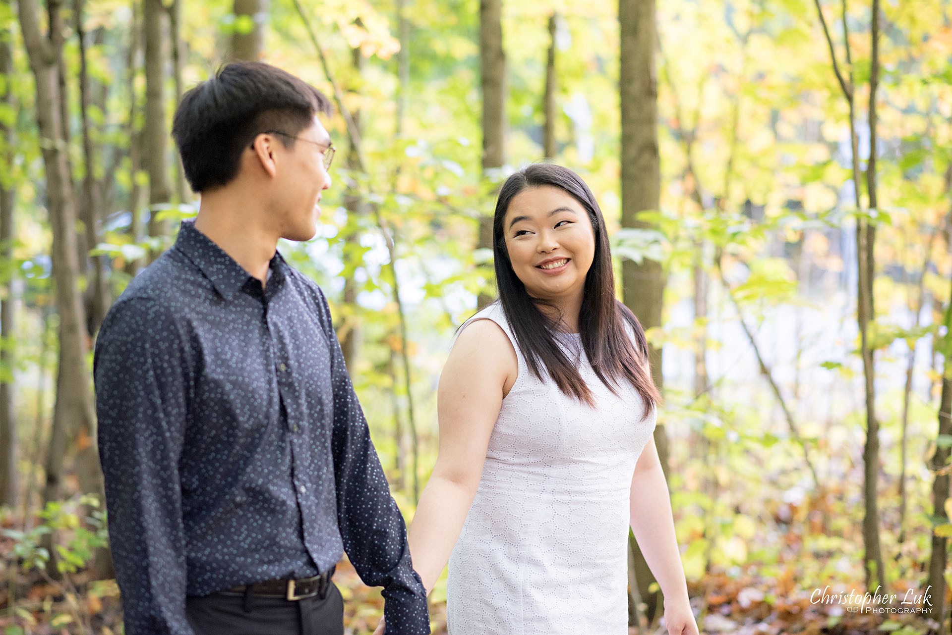 Christopher Luk Toronto Wedding Photographer Stouffville Forest Conservation Park Engagement Session Candid Natural Photojournalistic Bride Groom Walking Together Pond Autumn Fall Leaves