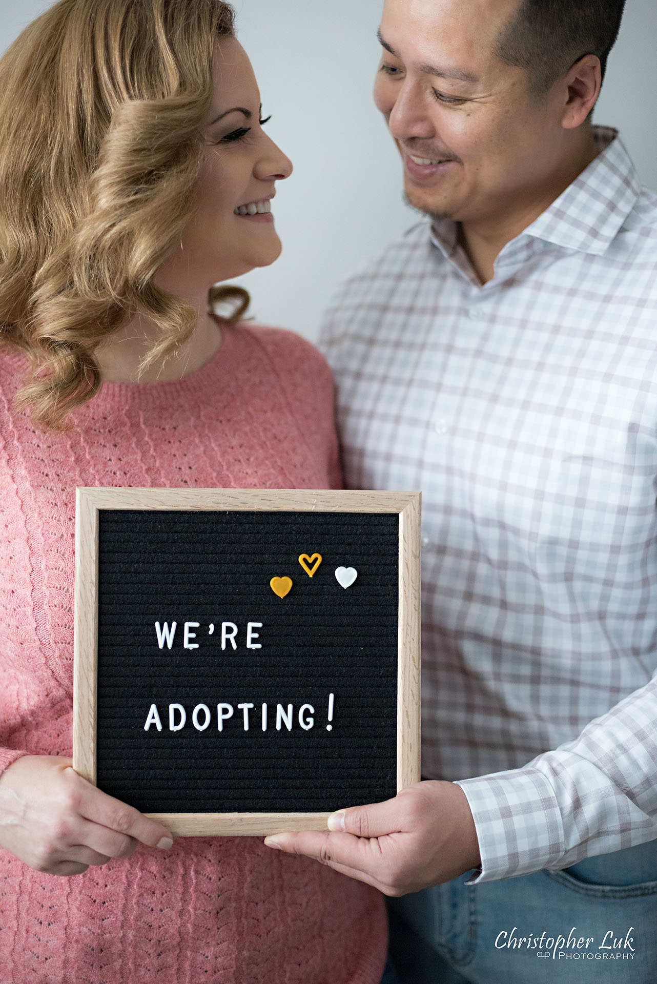 Christopher Luk Toronto Markham Family Adoption LifeBook Photographer Pictures Photos Children Session Parents We're Adopting Letter Board Sign Smile Vertical Portrait