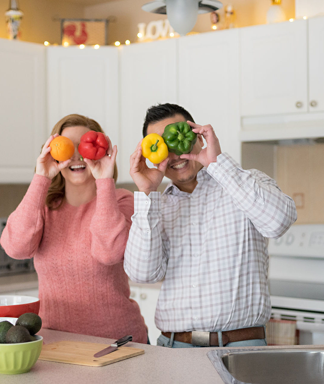 Christopher Luk Toronto Markham Family Adoption LifeBook Photographer Pictures Photos Children Session Parents Kitchen Preparation Life at Home Colourful Fun Bell Peppers Orange Eyes Eyeballs Funny
