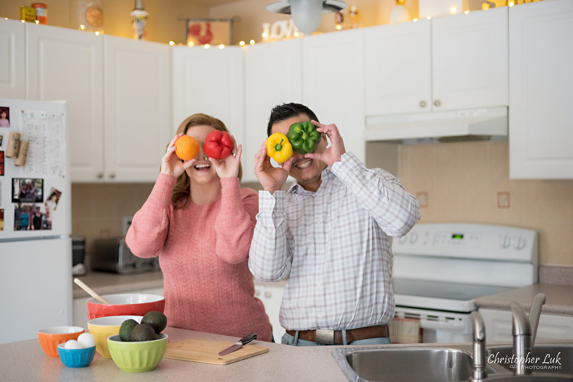 Christopher Luk Toronto Markham Family Adoption LifeBook Photographer Pictures Photos Children Session Parents Kitchen Preparation Life at Home Colourful Fun Bell Peppers Orange Eyes Eyeballs Funny