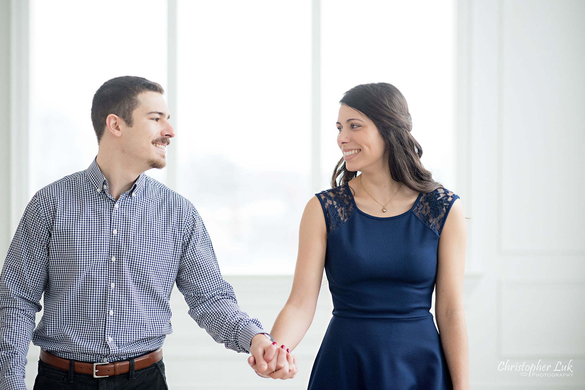 Christopher Luk Toronto Wedding Photographer Mint Room Studios Conservatory Engagement Session Winter Indoor Natural Light Candid Photojournalistic Bride Groom Holding Hands Walking Together Smile