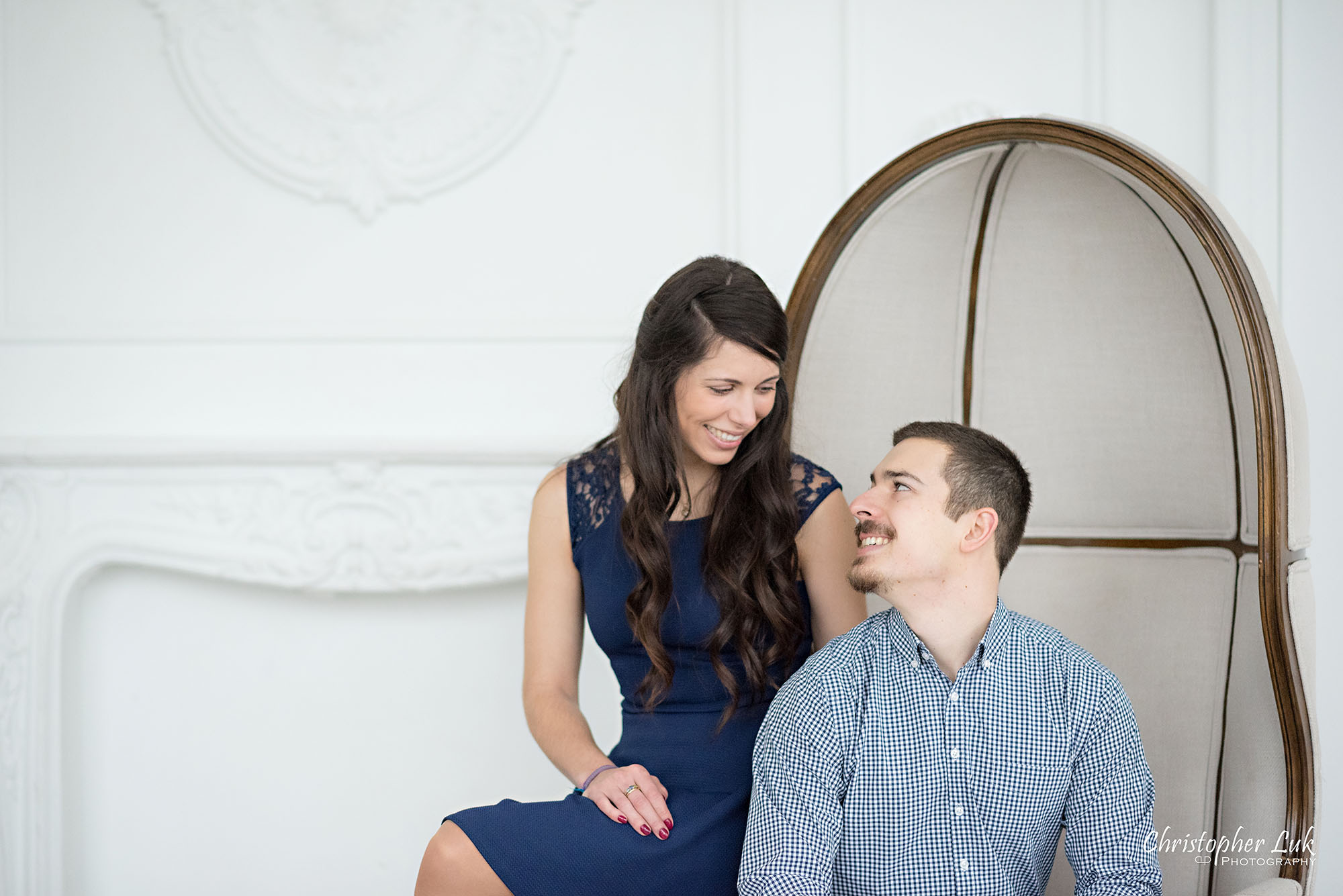 Christopher Luk Toronto Wedding Photographer Mint Room Studios Conservatory Engagement Session Winter Indoor Natural Light Candid Photojournalistic Bride Groom Beige Dome Chair Smile