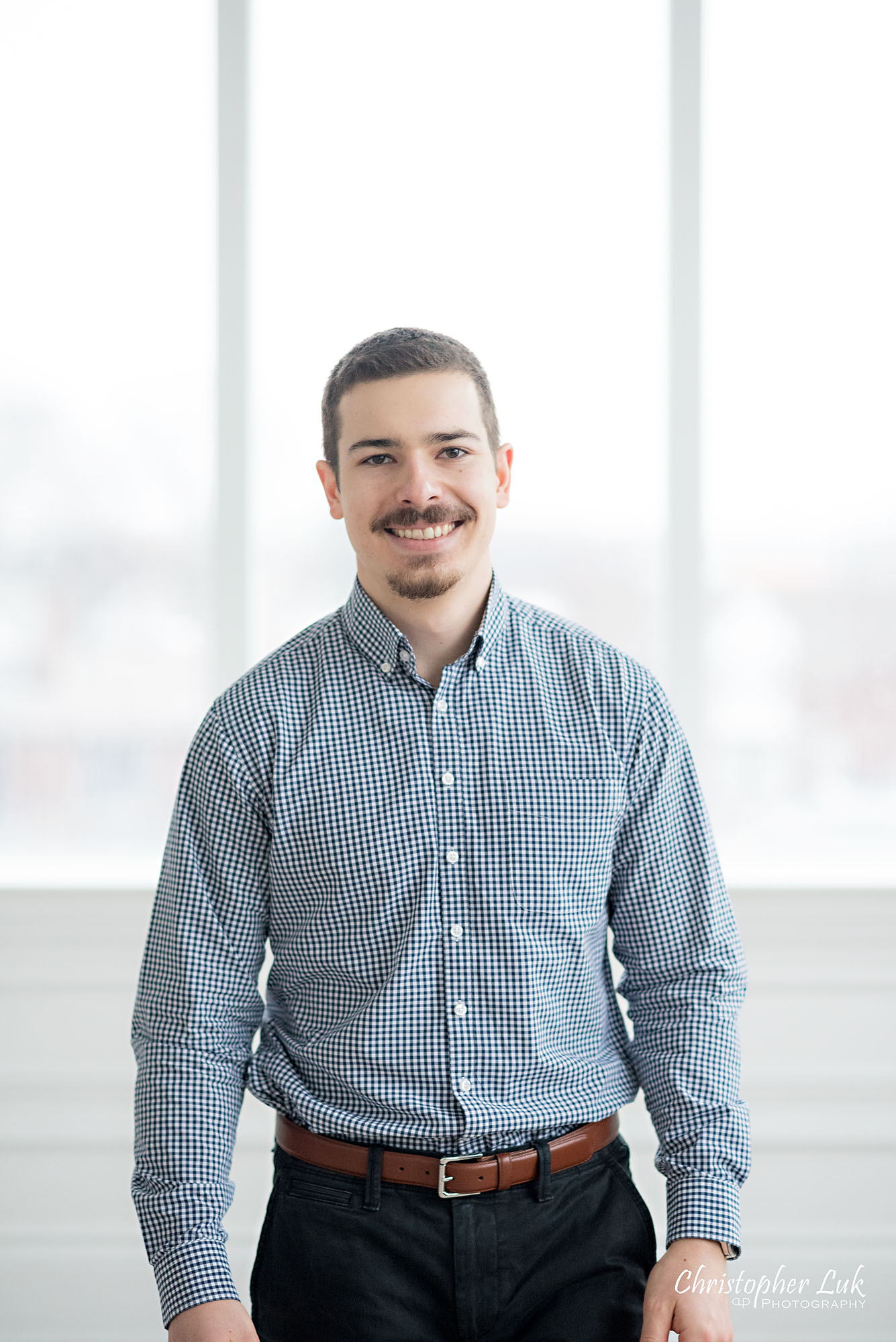 Christopher Luk Toronto Wedding Photographer Mint Room Studios Conservatory Engagement Session Winter Indoor Natural Light Candid Photojournalistic Groom Smile