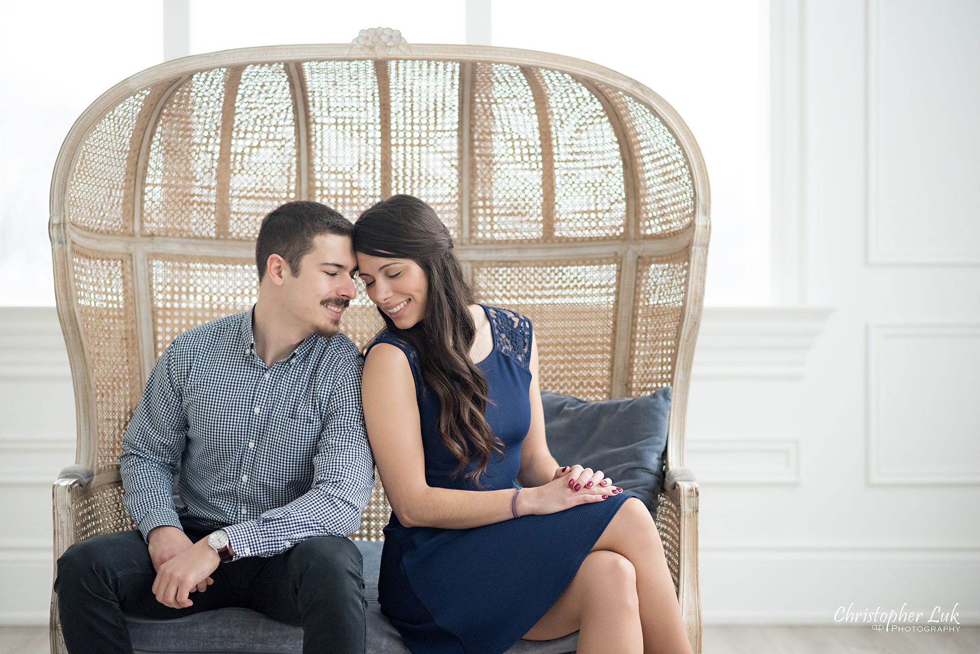 Christopher Luk Toronto Wedding Photographer Mint Room Studios Conservatory Engagement Session Winter Indoor Natural Light Candid Photojournalistic Bride Groom Wicker French Rustic Vintage Dome Loveseat Chair Snuggle Touch Adorable Cute Intimate