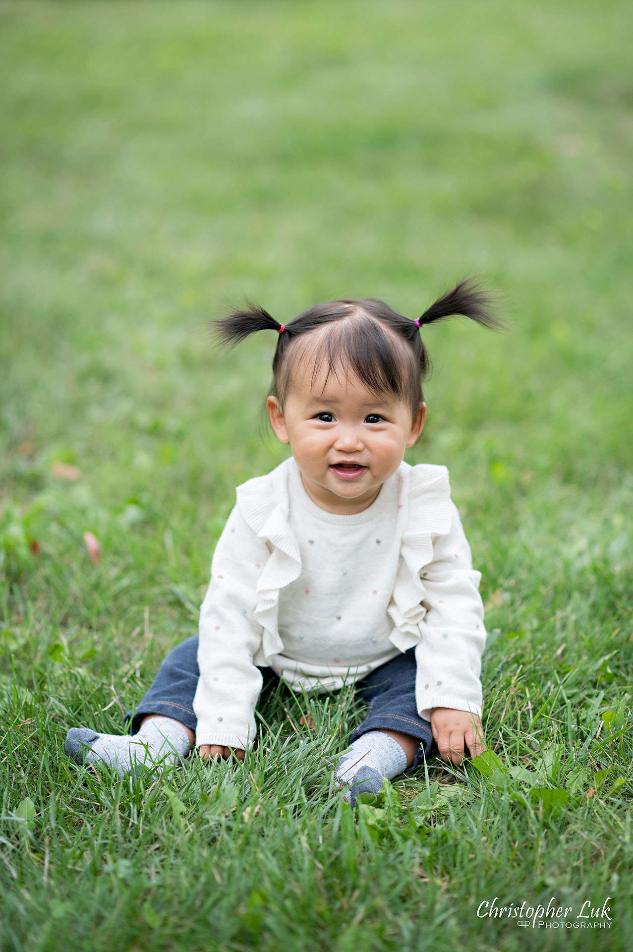 Christopher Luk Toronto Markham Family Wedding Photographer Baby Girl Natural Candid Photojournalistic Sitting Smiling Happy Pig Tails Portrait