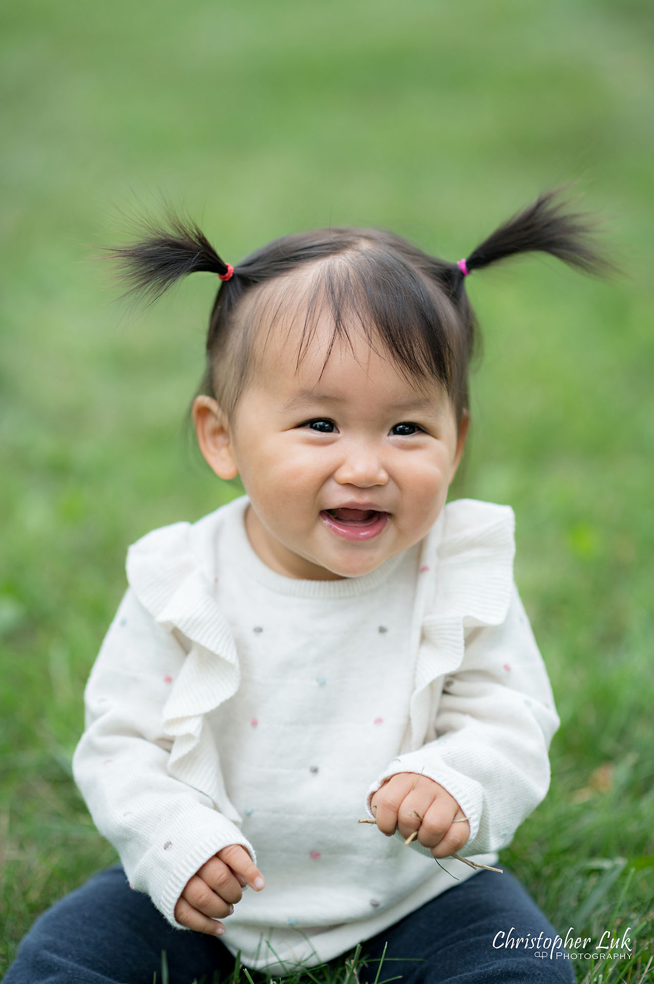 Christopher Luk Toronto Markham Family Wedding Photographer Baby Girl Natural Candid Photojournalistic Sitting Smiling Happy Portrait Close Up Detail Pig Tails