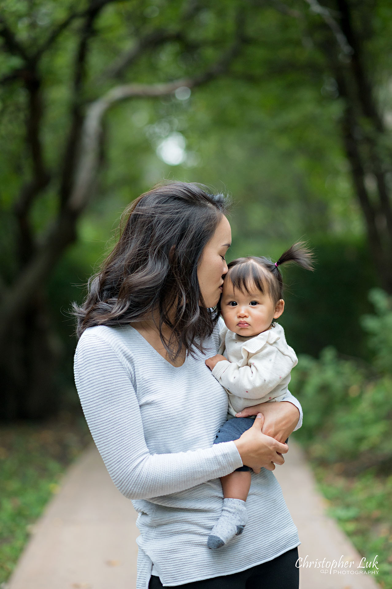 Christopher Luk Toronto Markham Family Wedding Photographer Baby Girl Natural Candid Photojournalistic Mom Mother Motherhood Daughter Vertical Hug Hugging Kiss Portrait