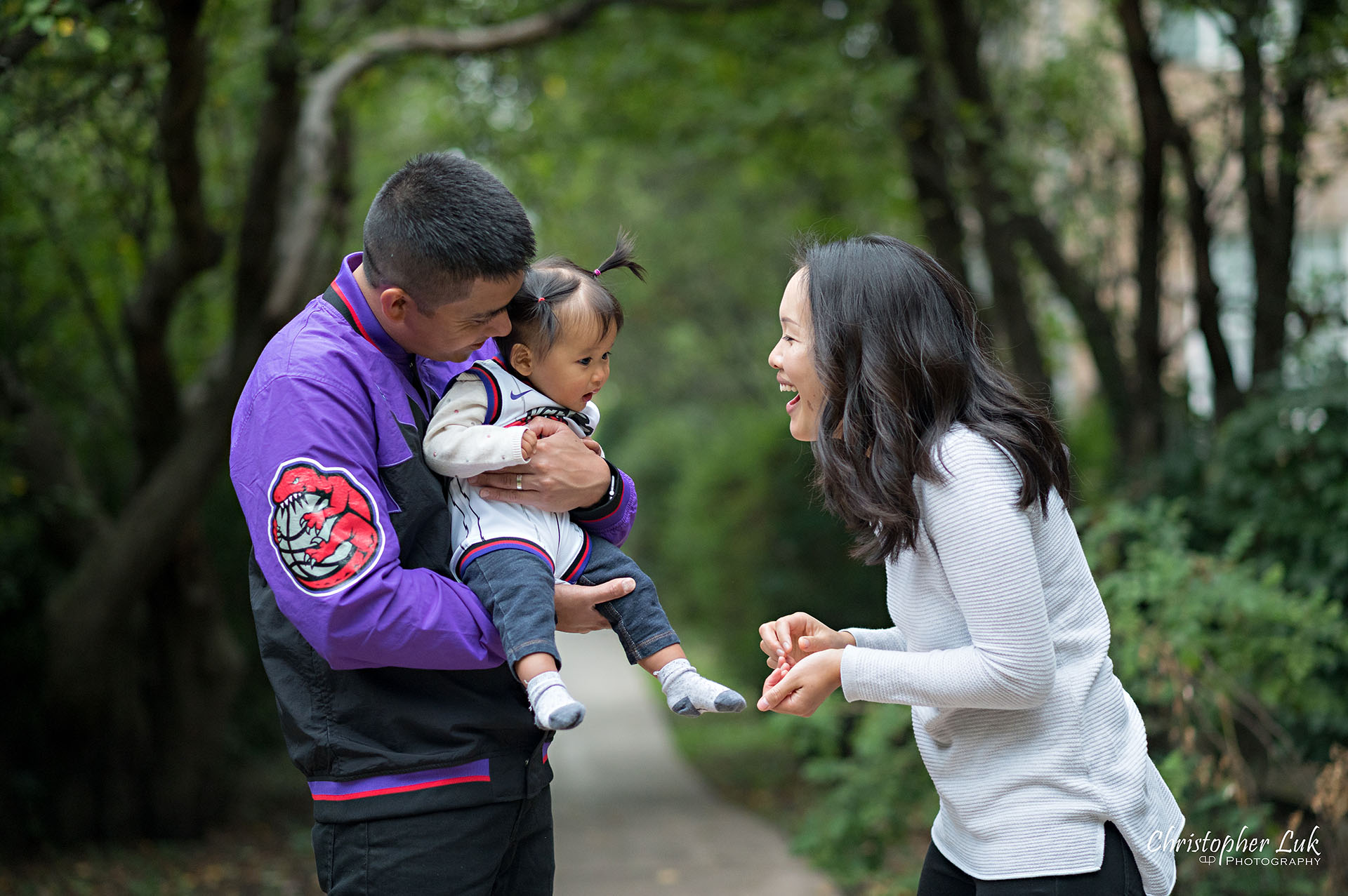 Christopher Luk Toronto Markham Family Wedding Photographer Baby Girl Natural Candid Photojournalistic Mom Dad Mother Father Motherhood Fatherhood Daughter Landscape Together Toronto Raptors We the North Over Everything Snack Laughing