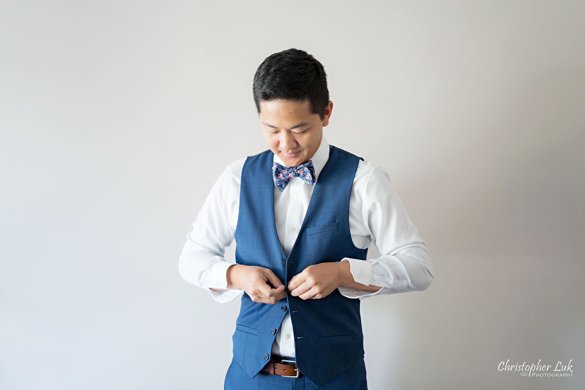 Christopher Luk Toronto Wedding Photographer Bridle Trail Baptist Church Unionville Main Street Crystal Fountain Event Venue Groom Vest Blue Navy Waistcoat Getting Ready Natural Photojournalistic Candid Smile