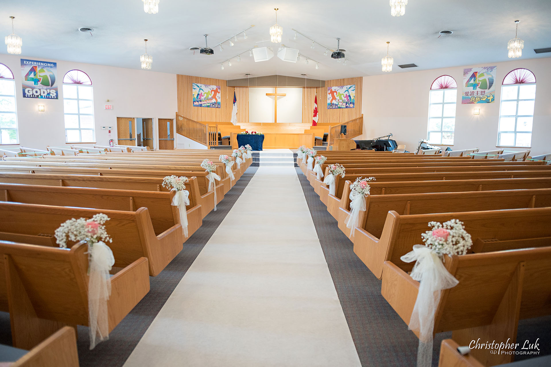 Christopher Luk Toronto Wedding Photographer Bridle Trail Baptist Church Unionville Main Street Crystal Fountain Event Venue Ceremony Location Interior Pews Rows Flowers Little White Baby's Breath Rose Pink Drapery Fabric Flower Bell by Masami Decor